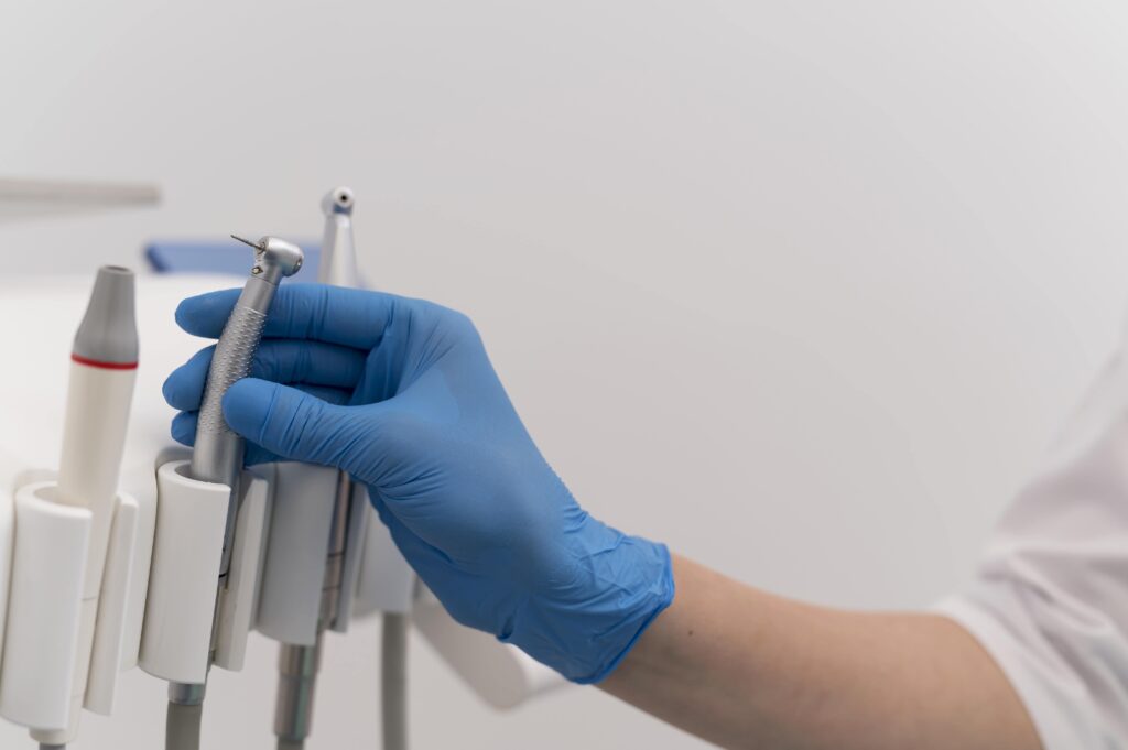 orthodontist-with-latex-glove-handling-dental-equipment-min